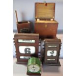 Two vintage mahogany desk top adjustable calendars, a wooden ticket dispenser with vintage tickets