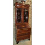 An inlaid Edwardian mahogany bureau bookcase with satinwood crossbanding, shell and further detail