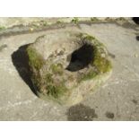 An early weathered carved natural stone mortar, octagonal, with pronounced lugs, 40cm across x