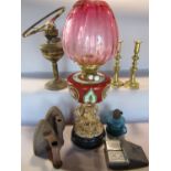 A W&S oil lamp with a pink shade and floral overlaid china font on an ornate base 62cm high, two