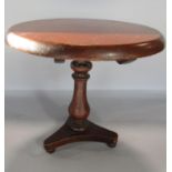 An apprentice piece Georgian style mahogany circular tilt top tripod table.