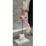 A life size sculpture/study of a red kite in flight by Bob Rowley mounted and set within a stone