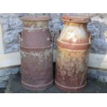 Two weathered vintage heavy gauge milk churns and caps with loop handles, Cadbury's Bros Ltd and CWS