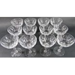 A dozen cut glass Champagne bowls with centre-knopped facet stem.