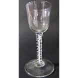 A Georgian wine glass, with funnel bowl over an opaque twist and spiral stem, 14.5cm.