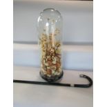 A dried flower arrangement set beneath a Victorian glass dome on a wooden base 50cm high, and a