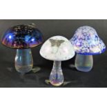 Two Glasform mushroom paperweights, a third similar and three further late 20th century