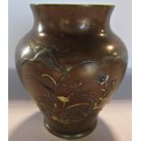 A 19th century Japanese bronze vase of birds amongst flowers, with highlights to the leaves and
