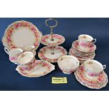 A Royal Albert Serena tea service for twelve with additional shaped dish and two tier cake stand,