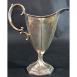 An early 20th century silver cream jug, London 1905, makers mark rubbed, stamped Asprey London to
