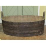 A coopered oak and steel banded oval tub 94cm x 61cm x 45cm (full height)