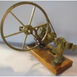 A 19th century brass watch maker’s lathe set on a wooden stand. 30cm wide at base.