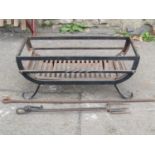 A cast iron fire basket of rectangular form, together with three fire tools, 62 cm wide x 30 deep