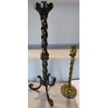 A single bronze spiral twist candlestick on three swept supports 50cm high and brass finished spiral