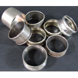 Eight assorted silver napkin rings, 3.7oz approx two mother of pearl silver bladed pen knives, a