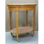 A contemporary reproduction Georgian style two tier satinwood veneered oval occasional table with