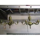 A pair of cast brass hanging ceiling lights, each with five scrolling branches gadroon and further