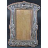 An art nouveau designed silver photo frame, pinned to an oak frame, Birmingham 1911, maker Sanders &