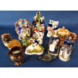 A collection of 19th century Staffordshire flatware figures including The Rocket, Queen Victoria and