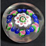 A mid 19th century Clichy millefiori paperweight with a central cone ringed by eight red and white