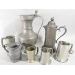19th century pewter ware, including five varied tankards, and two jugs with hinged lids. 6