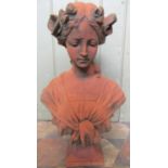 A cast composition stone head and shoulder bust of an Art Nouveau style female character with