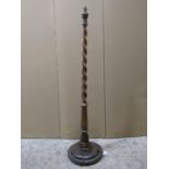 A 1920s standard lamp with spiral twist stem, raised on disc domed shaped base 150 cm (measurement