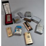 Eleven vintage cigarette lighters, the Penguin, Kingsway, Ronson and others