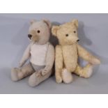 Two teddy bears each with jointed body, glass eyes, stitched nose and claws and firmly stuffed body,