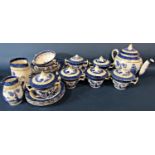 A collection of Booths Real Old Willow pattern ware including soup bowls and covers, tea pot,
