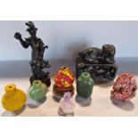 A collection of Chinese scent bottles, soapstone carving, two jadeite figures and a jadeite Buddha.