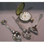 A miniature silver anointing spoon, a silver souvenir teaspoon from Breadalbane, a silver pusher and