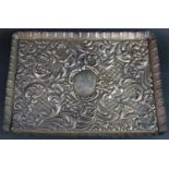 A silver embossed tray decorated with cherubs, scrolling and birds, London 1904, maker Charles Henry