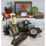 A miscellaneous collection of items including a fish glug jug, vintage hole puncher , a pair of