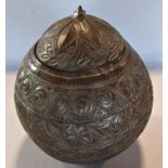 A 19th century coconut tea caddy, geometrical and floral carved and incised decoration, (loose lid