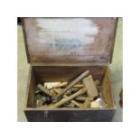 A small antique stained pine box with hinged lid, containing small collection of hand tools