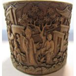 A Chinese bamboo brush pot intricately carved with everyday domestic scenes, 10cm high x 12.5cm