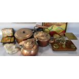 A miscellaneous collection of items including two copper kettles, a copper saucepan, a leather waste