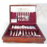 A Victorian mahogany cased set of fruit knives and forks with mother of pearl handles, an oak