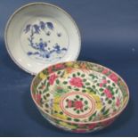A Chinese famille rose bowl with repeating floral detail and a further Chinese blue and white