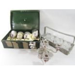 An early 20th pewter glass carrier decorated with fish blowing opalesque cabochon bubbles, with