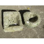 Two small carved natural stone troughs of rectangular and circular form, the rectangular example