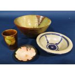 A small collection of studio ware including bowls, a shallow dish and a beaker