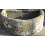 A weathered natural stone D shaped trough with drainage hole, 62cm wide x 47cm deep x 22cm high