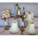 Two onyx table lamps and an onyx three branch ceiling light, a brass table lamp and a selection of