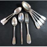 A mixed selection of eight Georgian and Victorian serving and dessert spoons including a dessert