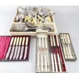 A selection of Georgian style silver plated flatware and four boxed sets of bone handled knives.