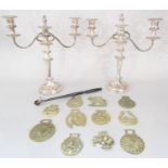A pair of silver plated Georgian style convertible candelabra from single candle use to a scrolled