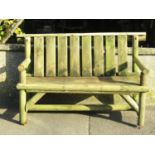 A weathered rustic two seat garden bench (af) 127 cm wide