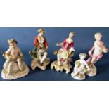 Five 19th century porcelain cabinet figures with bocage decoration